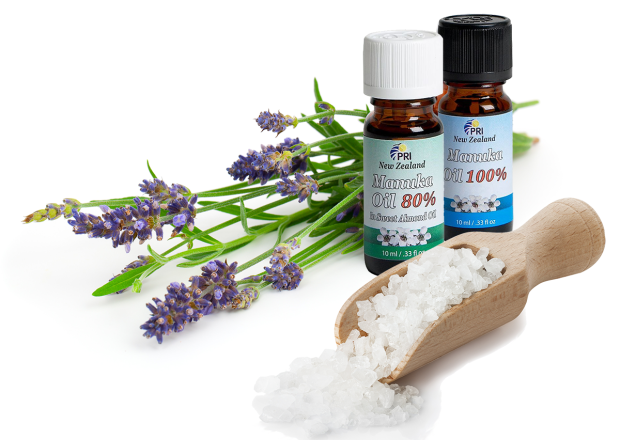 Lavender sprigs, natural salt crystals, and bottles of Manuka oil from New Zealand